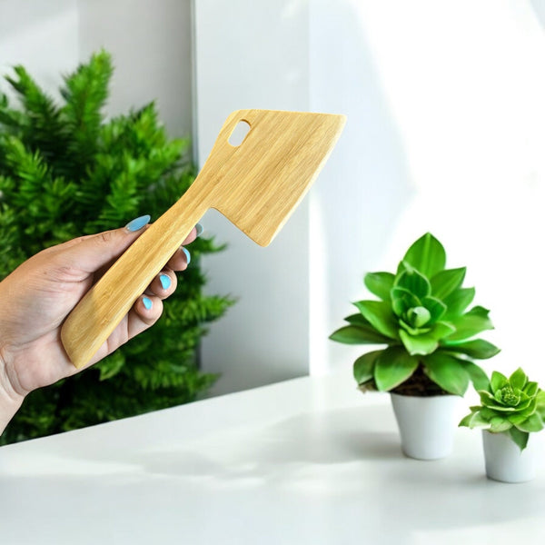 Close-up of the Bamboo Dough Scraper's curved edge and wood grain