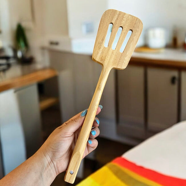 Bamboo Slotted Spatula lying on a kitchen surface