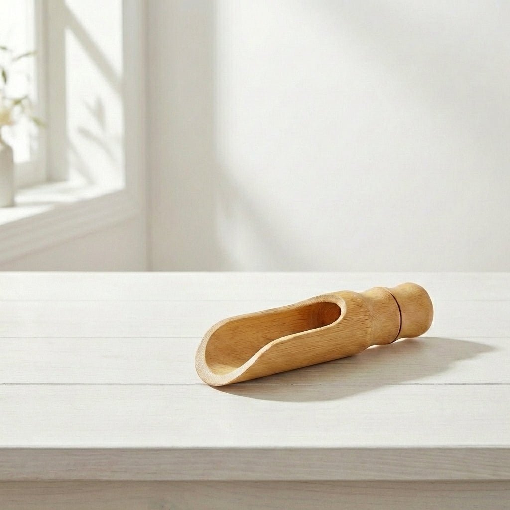 Bamboo Laundry Scoop shown with laundry powder