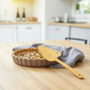 Close-up of the Bamboo Serving Spatula's smooth bamboo blade