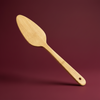 Bamboo Serving Spatula with ergonomic handle on a kitchen surface