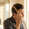 Foldable bamboo hair comb shown in its compact folded position