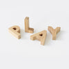Close-up of bamboo alphabet letters showing size and thickness, ideal for small hands