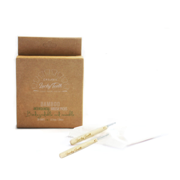 Bamboo toothbrushes with packaging on a white background