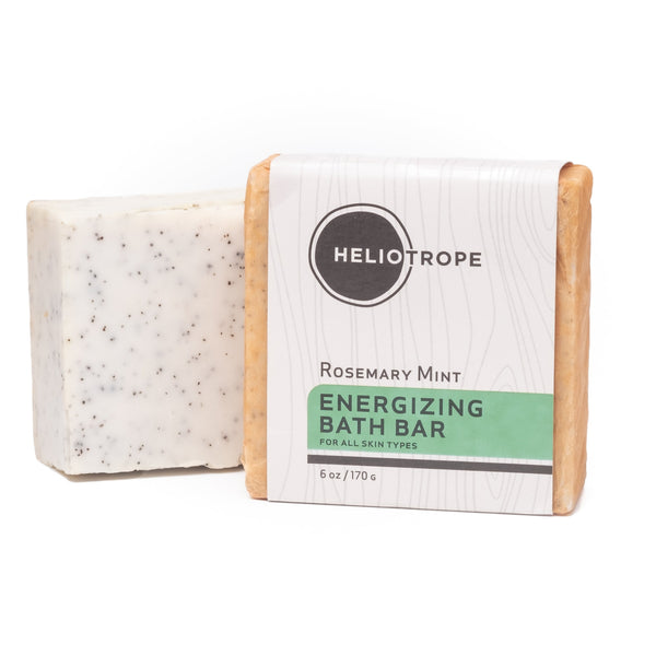 Two oversized 6oz natural exfoliating soap bars by Heliotrope SF with botanical ingredients