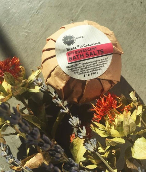 Natural bath fizzy surrounded by fresh flowers — eco-friendly bath bomb by Heliotrope San Francisco