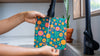 Meli Wraps beeswax food wrap being washed with cool water and mild dish soap