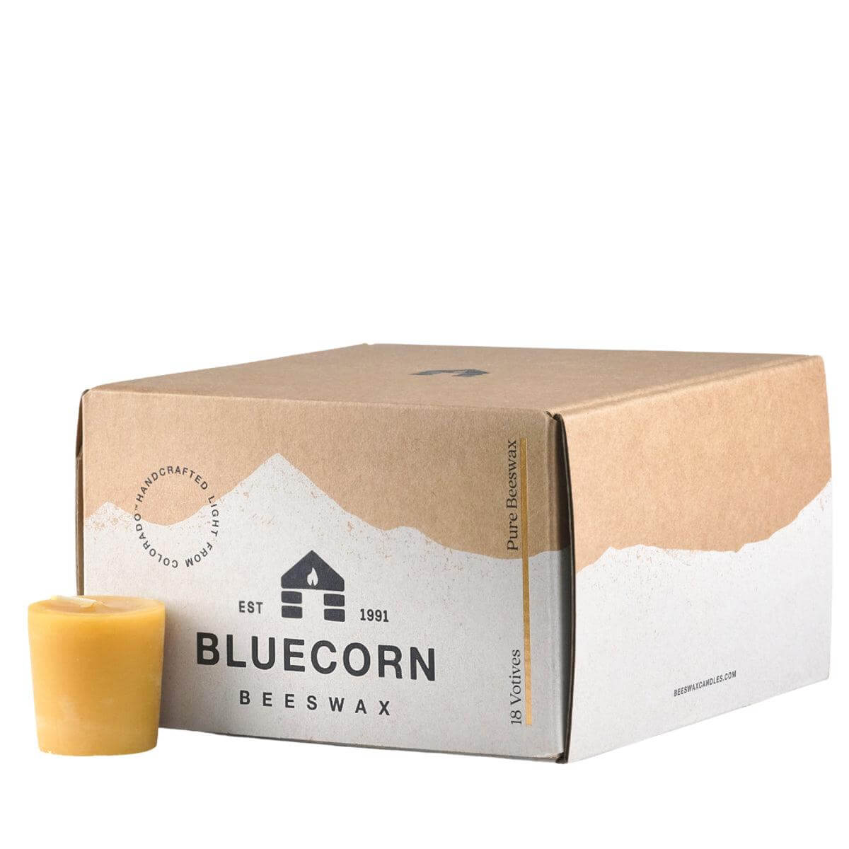 Bluecorn pure beeswax votive candles grouped together on a neutral surface