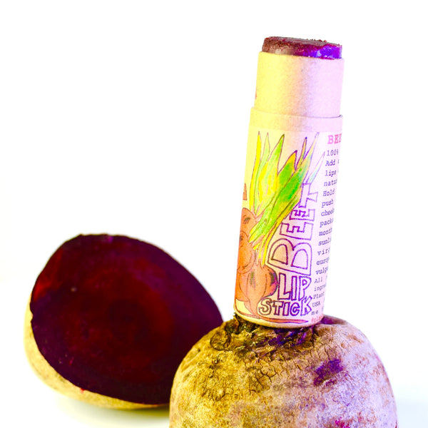 Lip balm on a rock with a white background