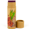 Beet lip balm stick with cardboard packaging on a white background