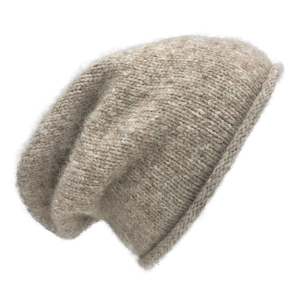 Beige knit beanie on a white background