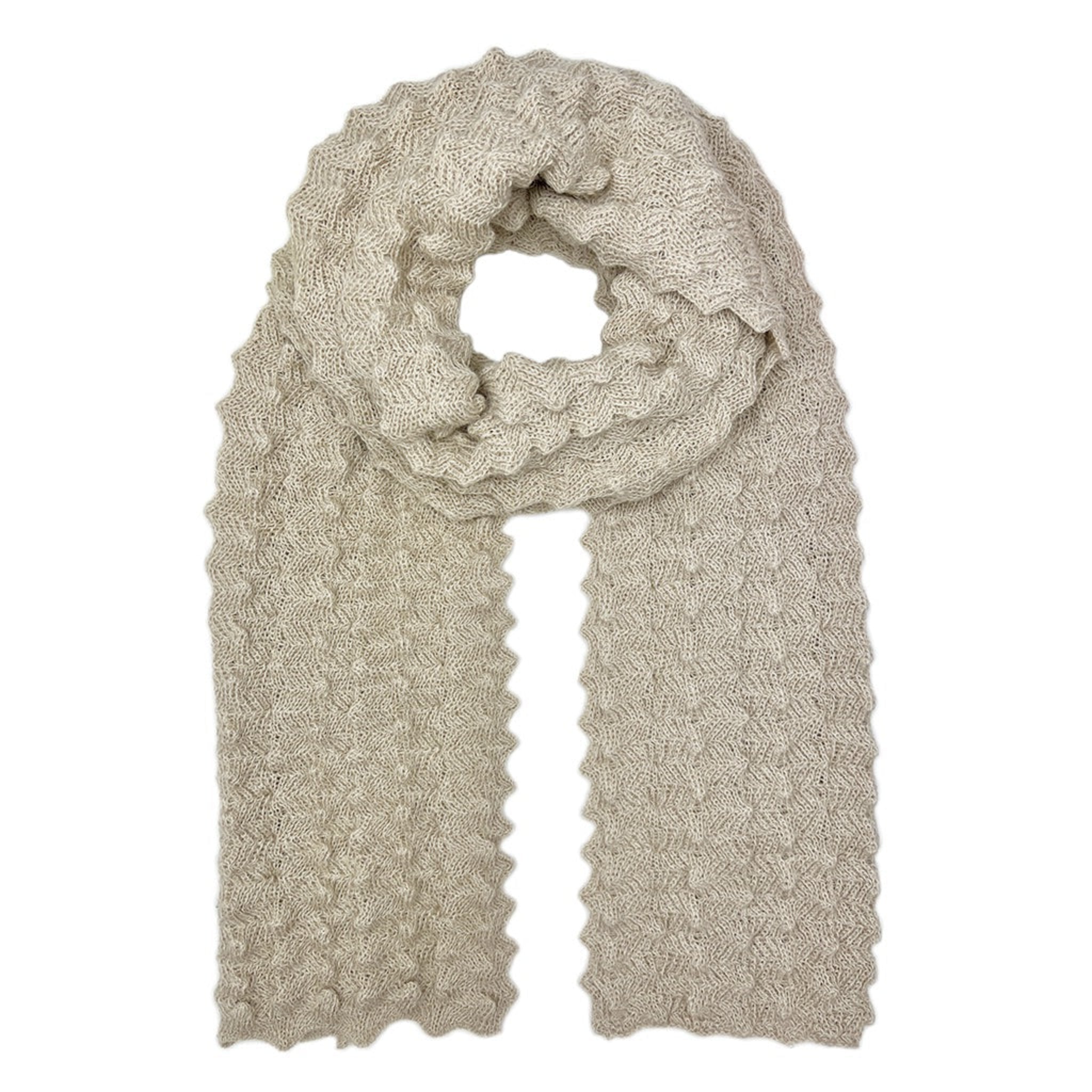 Beige knitted scarf on a white background