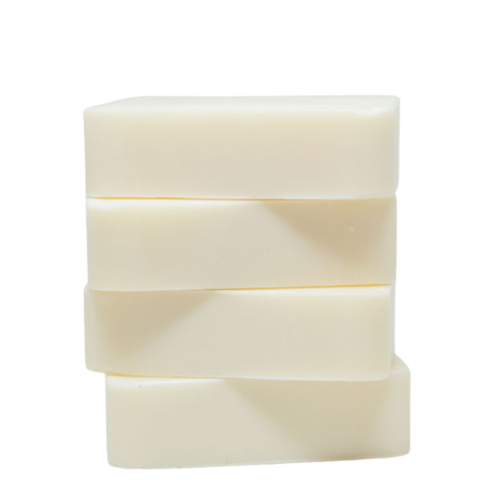 Three stacked bars of soap on a white background. 3-ingredient natural soap bar with coconut oil, shea butter & sunflower oil — dermatologist approved for eczema, psoriasis & sensitive skin. Safe for babies. Shop now.
