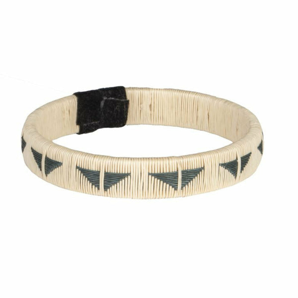 Beige bracelet with black triangle patterns on a white background