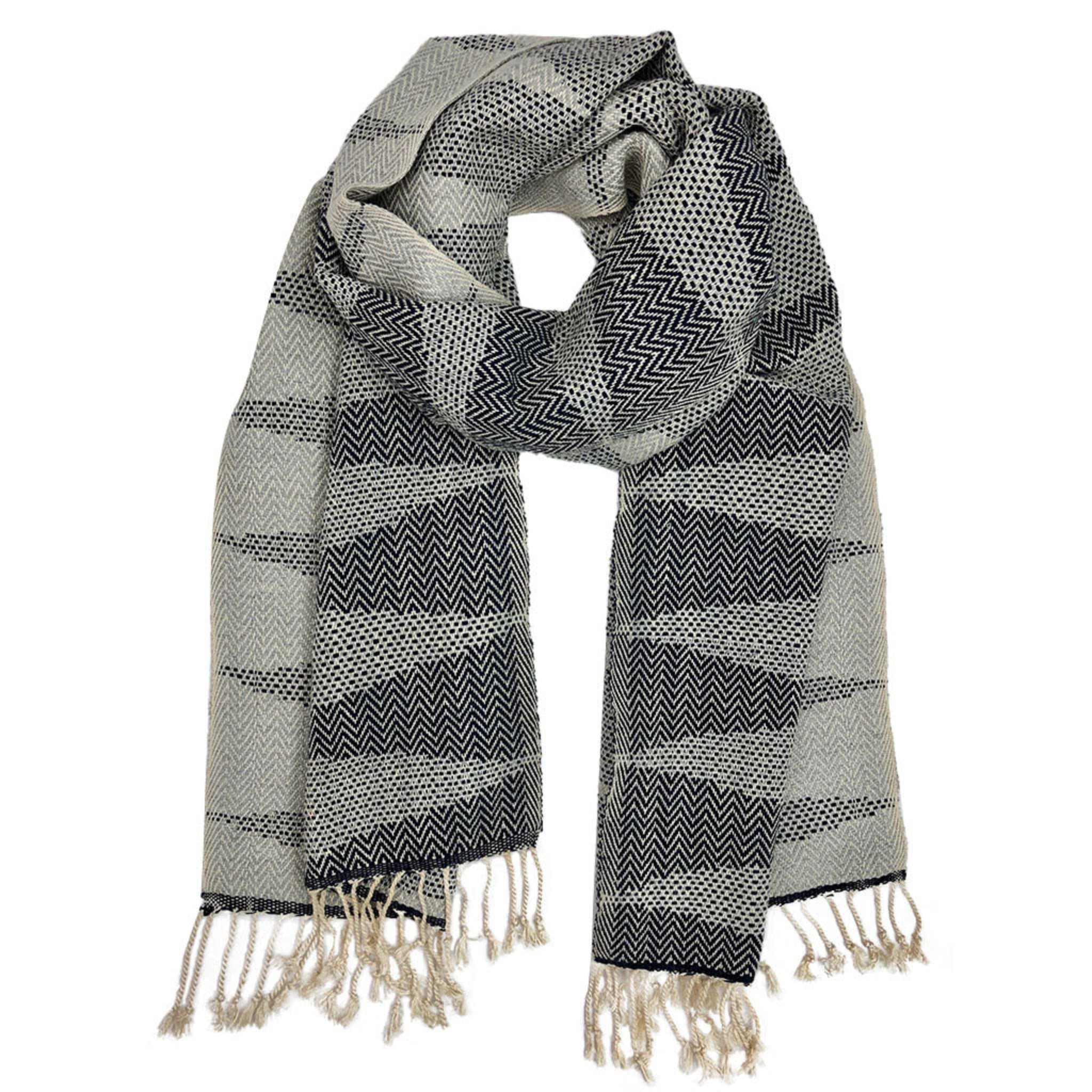 Gray and black patterned scarf with fringes on a white background