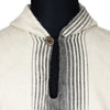 Close-up of black and grey gradient diamond weave pattern on ivory alpaca poncho