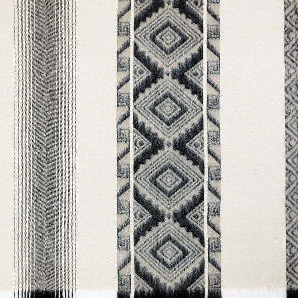 Textile with geometric pattern and stripes on a white background