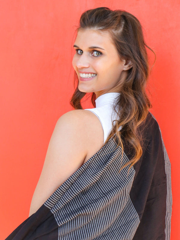 Close-up of black patterned woven scarf showing block print detail, ethically made in Vietnam
