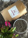 Bag of Bloomin' Bloom Soil with a plant and soil sample on a concrete surface. Bloom Power Bundle — fast-acting Bloom Juice with 150+ microbes & slow-release Bloomin' Soil for explosive flowering. More blooms, bigger color. Perfect garden gift.