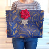 Flat lay of large navy reusable gift bag with illustrated forest animals pattern