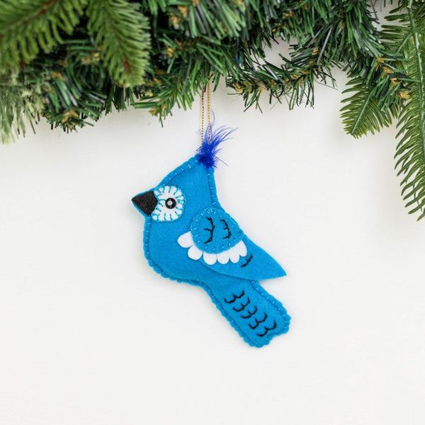 Add a touch of nature to your holiday decor with our adorable Felt Bluejay Ornament. Made from sustainable materials and featuring intricate embroidery, this ornament is the perfect addition to any Christmas tree. Order yours today!