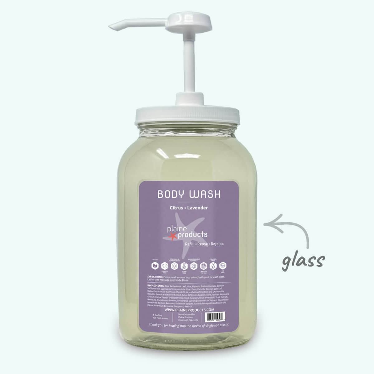 Glass body wash bottle with pump and lavender label on a white background