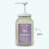 Glass body wash bottle with pump and lavender label on a white background