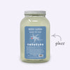 Large jar of body wash with a blue label on a white background
