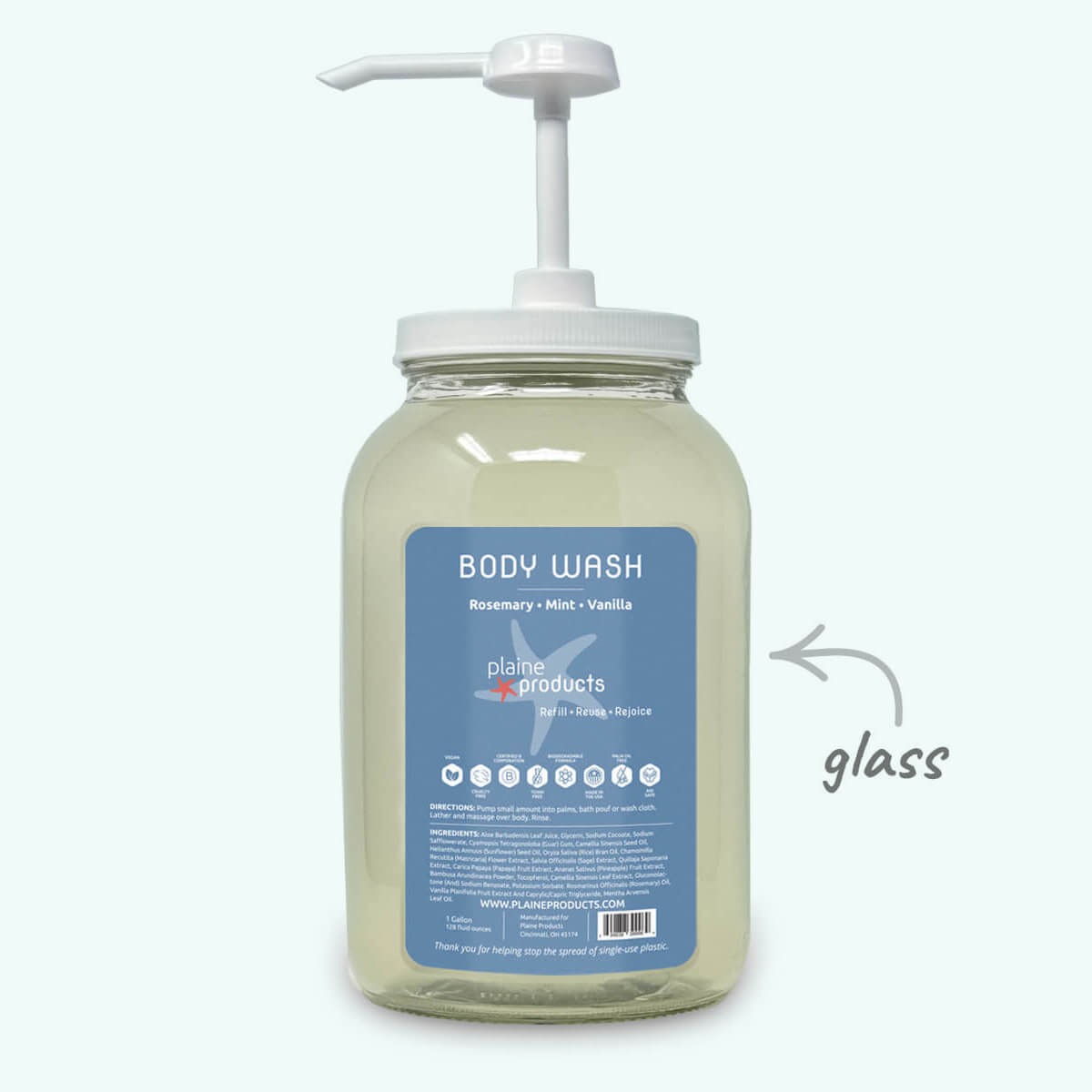 Glass body wash bottle with pump and blue label on a white background