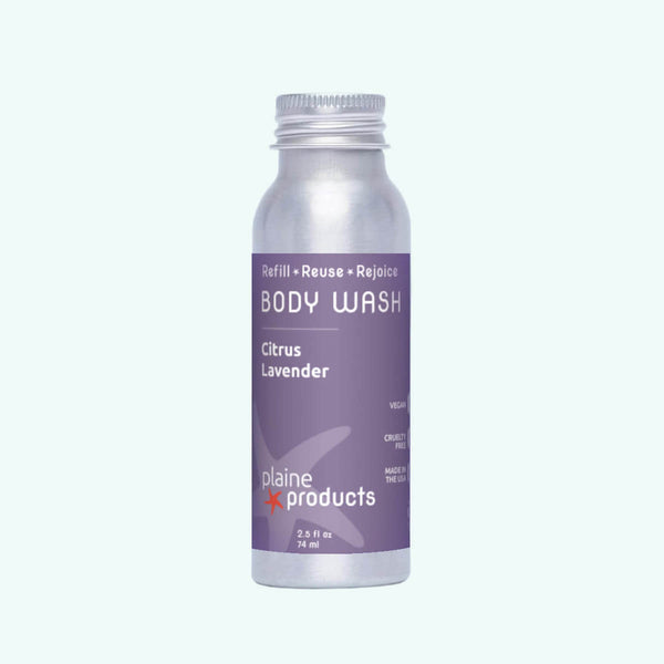 Body wash bottle with purple label on a white background