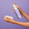 Plaine Products body wash lifestyle shot showing eco-friendly bottle in bathroom setting
