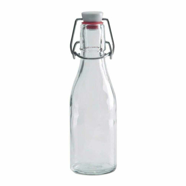 Clear glass bottle with a white lid on a white background