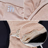 Close-up of beige fabric with a brand logo and stitching detail.