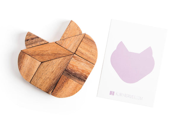 Wooden cat-shaped puzzle on a white background with a card featuring a cat illustration.