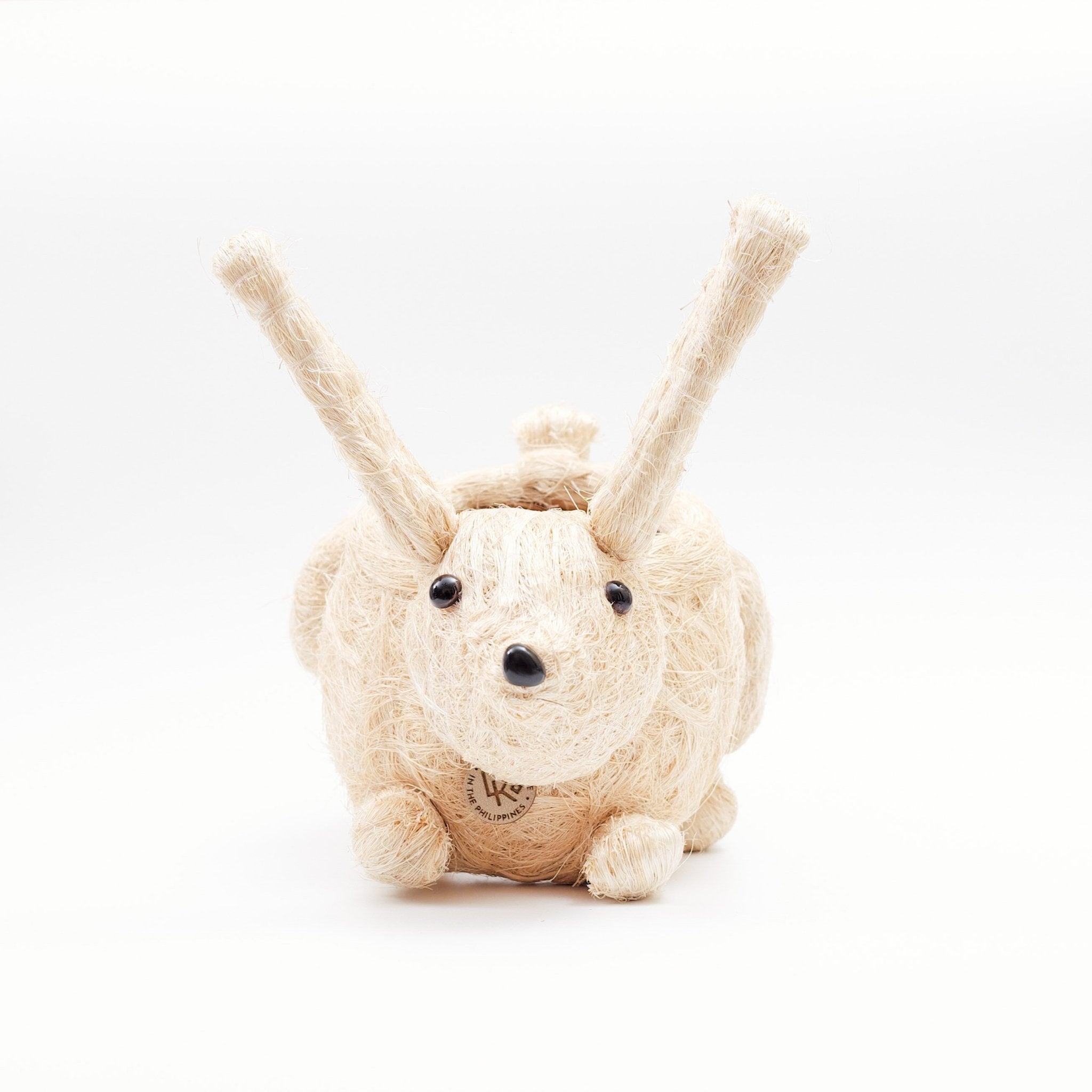 Plush toy hedgehog with long ears on a white background