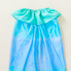 Blue and green gradient dress on a white background