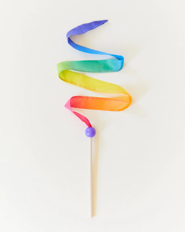 Colorful ribbon on a stick with a white background