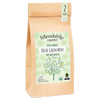 Bag of friendship organics Decaf Green Mint tea with a tree design on a white background