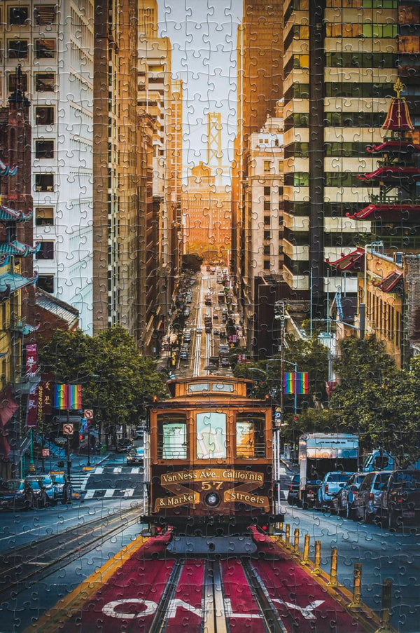 Completed California St Cable Car 500-piece jigsaw puzzle showing a San Francisco street view by Emanuel DeSousa