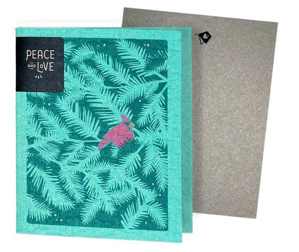 A greeting card with a green leafy pattern and a pink bird illustration, accompanied by a grey non-velope envelope.
