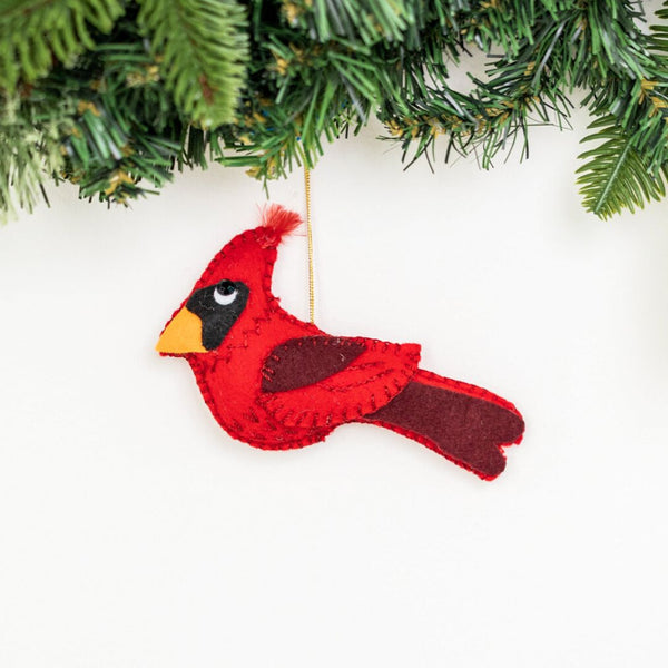 Add a touch of nature to your holiday decor with our eco-friendly Felt Cardinal Ornament. This handcrafted piece features intricate embroidery and vibrant colors. Order yours today!