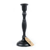 Two cast iron taper candle holders by Bluecorn Candles in small and large sizes on a neutral background