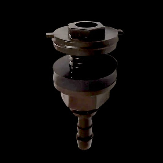 Metal valve or fitting on a black background