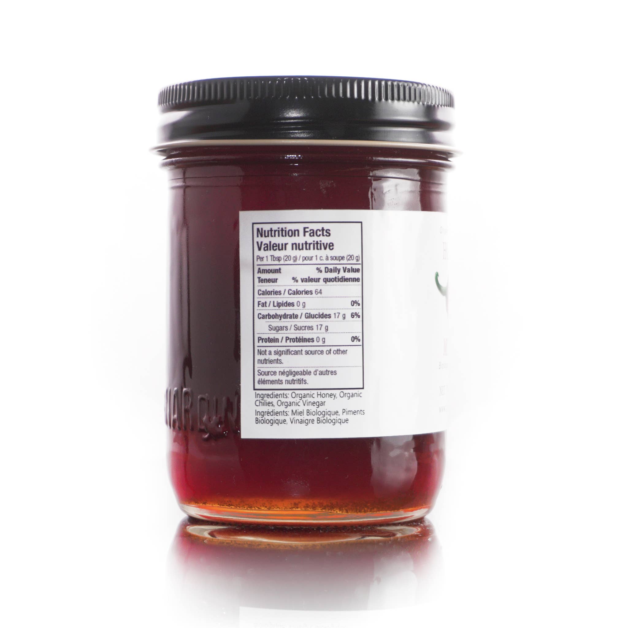 Jar of honey with a nutrition facts label on a white background