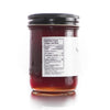 Jar of honey with a nutrition facts label on a white background