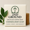 Upcycled coffee soap bar with '2nd Ground' branding, cedar & bay leaf scent, on a neutral background.