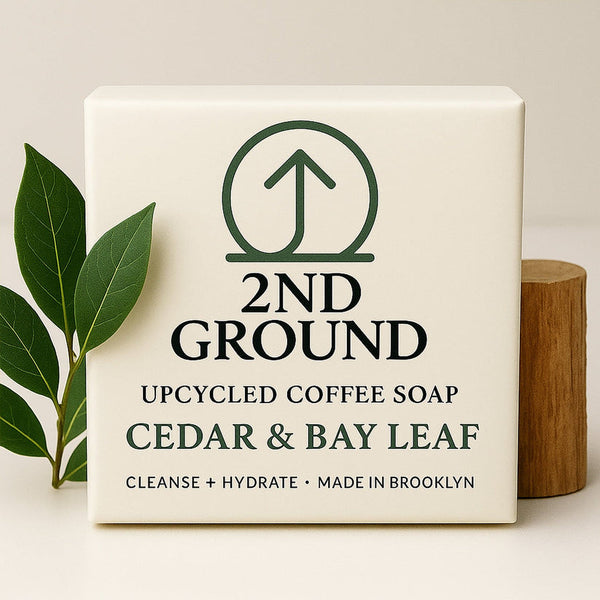 Upcycled coffee soap bar with '2nd Ground' branding, cedar & bay leaf scent, on a neutral background.