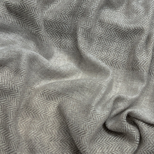 Close-up of gray fabric with a subtle pattern