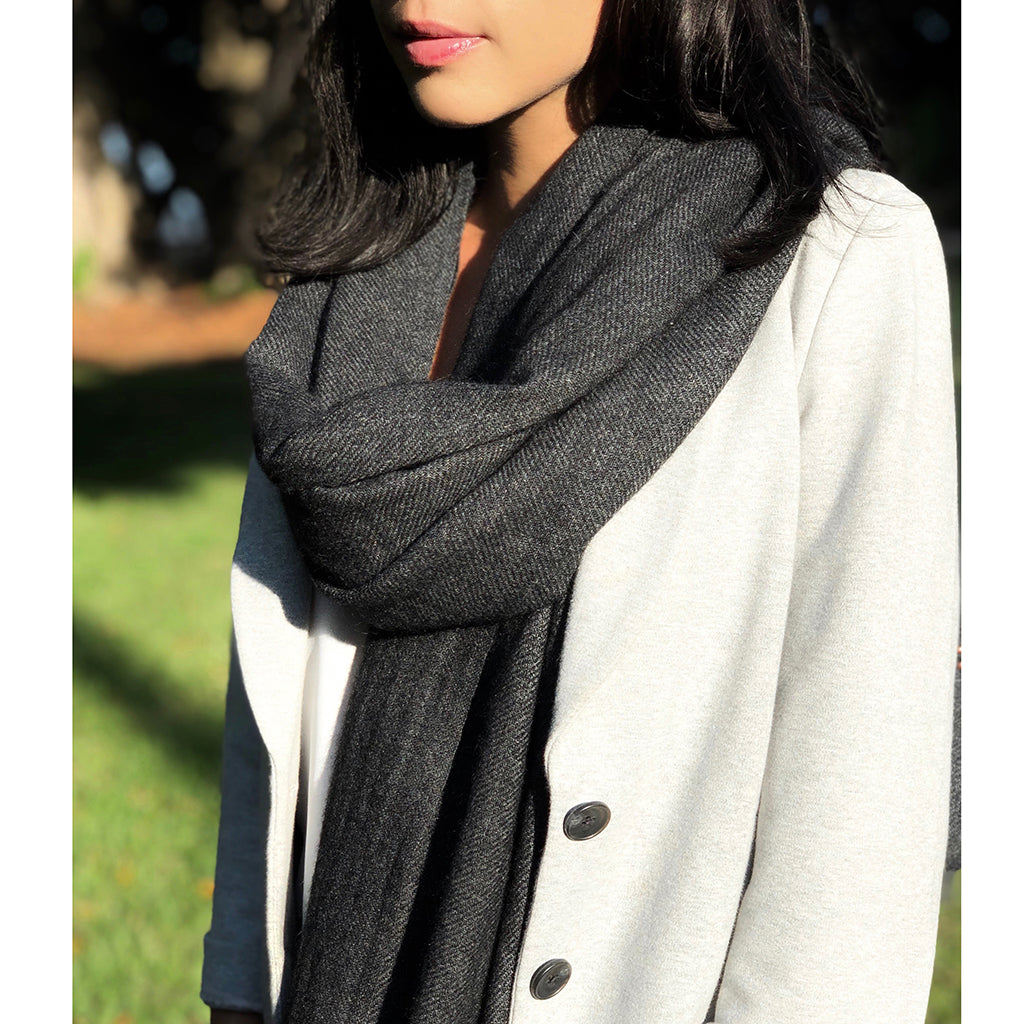 Indulge in the ultimate luxury with our Charcoal Handloom Cashmere Scarf. Crafted from sustainable cashmere, this scarf is incredibly soft, warm, and stylish. Perfect for any occasion, our scarf is a must-have for the eco-conscious fashionista. Shop now and experience the difference!