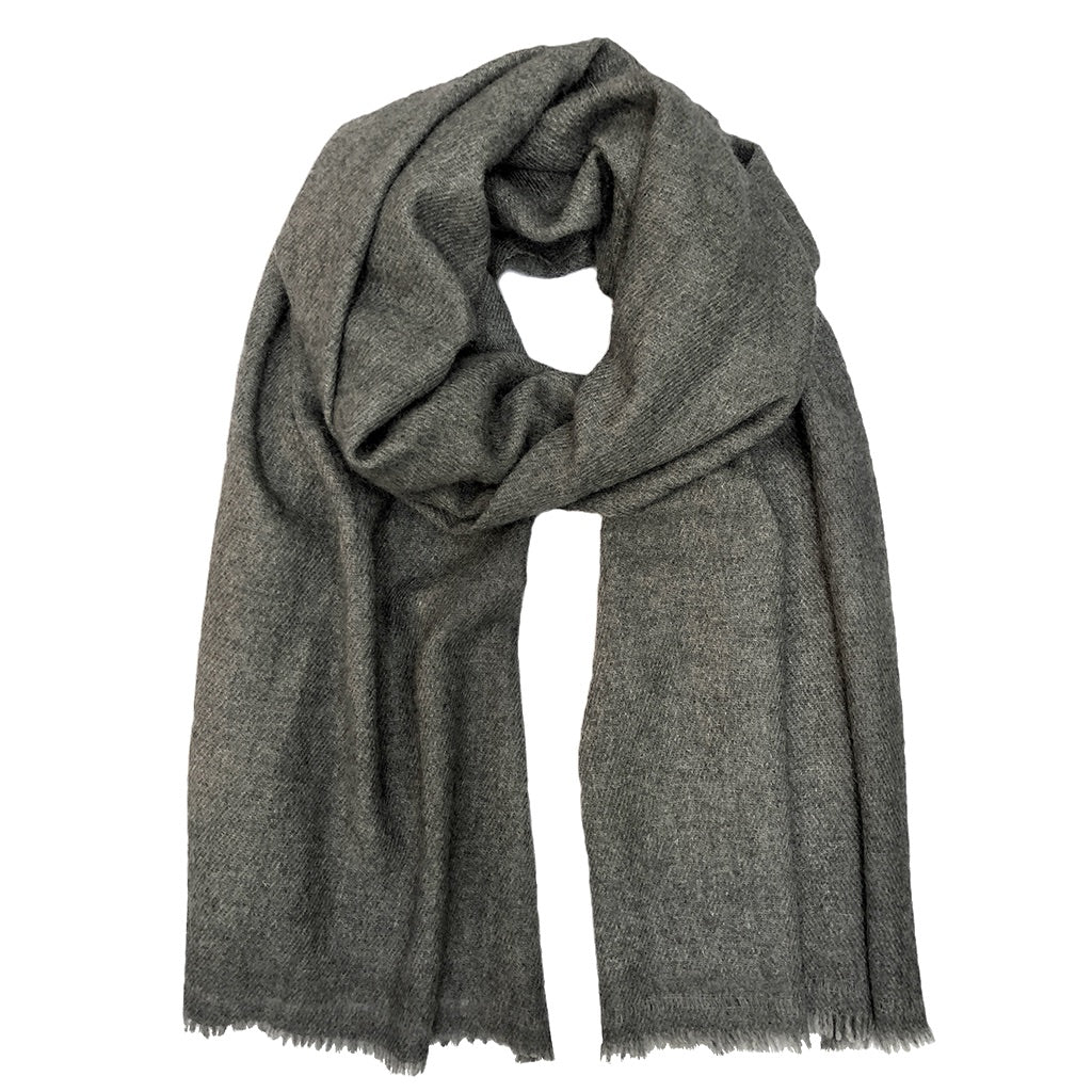 Indulge in the ultimate luxury with our Charcoal Handloom Cashmere Scarf. Crafted from sustainable cashmere, this scarf is incredibly soft, warm, and stylish. Perfect for any occasion, our scarf is a must-have for the eco-conscious fashionista. Shop now and experience the difference!